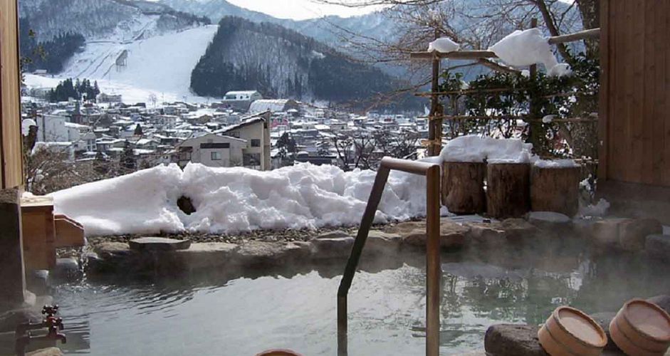 A soak in an onsen (natural hot springs) is a must at the end of a ski day. Photo: Nozawa Grand Hotel - image 0